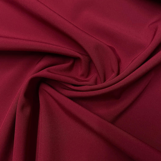 Close-up of draped maroon natural fabric from Nature's Fabrics.
