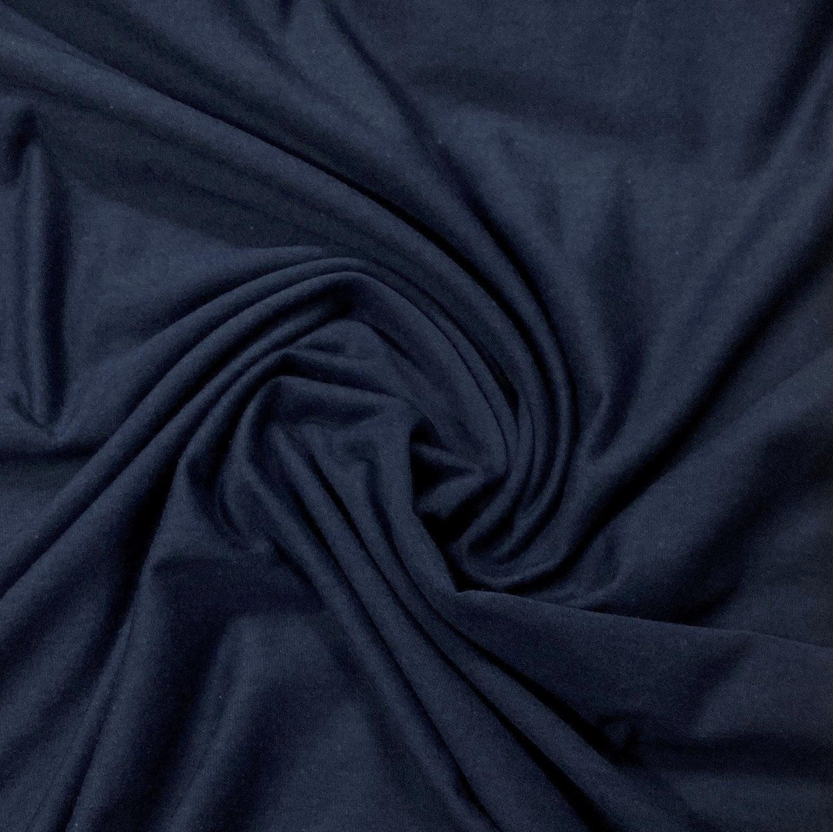 Navy blue premium natural fabric draped in swirls by Nature's Fabrics