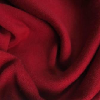 Close-up of draped red premium natural fabric from Nature's Fabrics