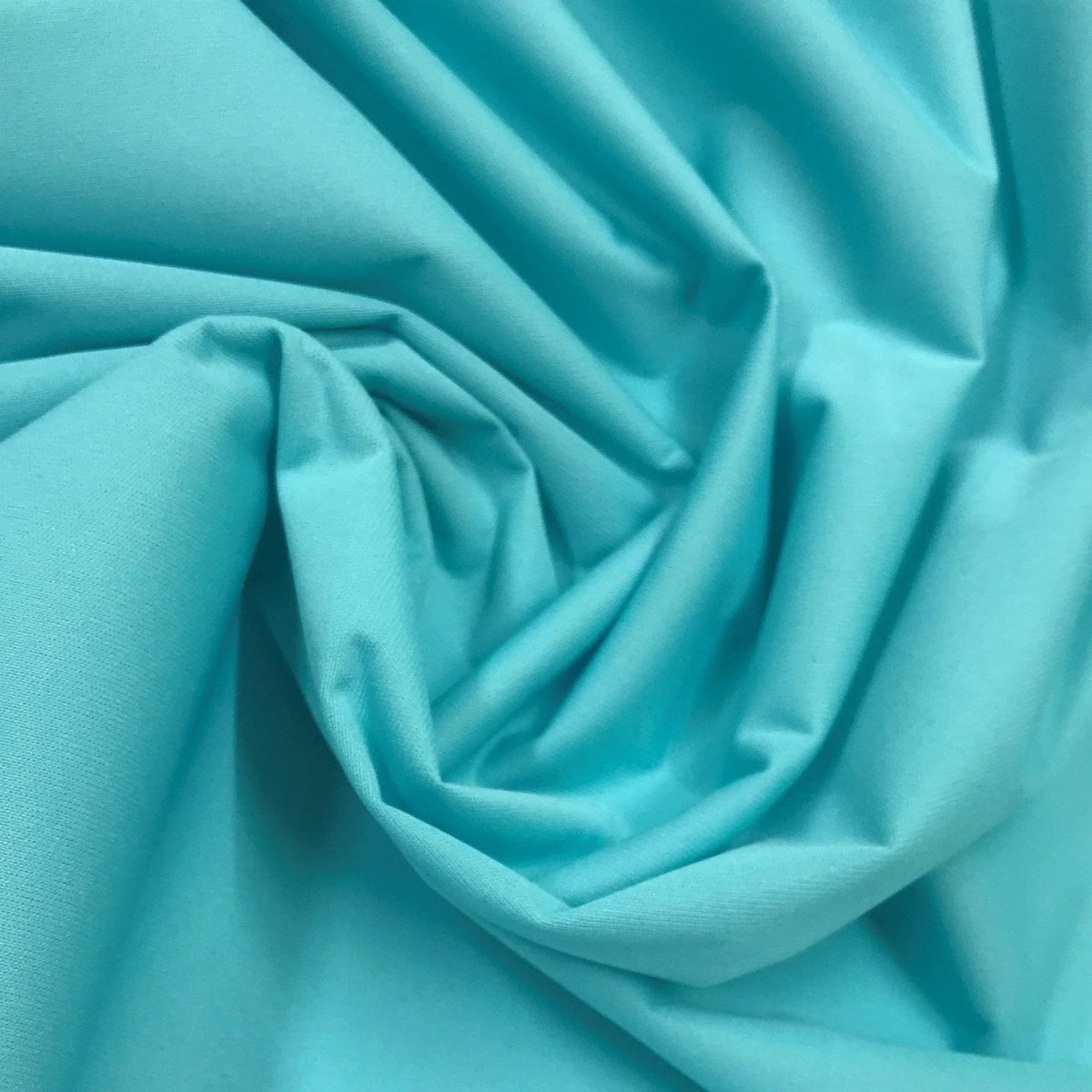 Close-up of draped light blue organic fabric from Nature's Fabrics.