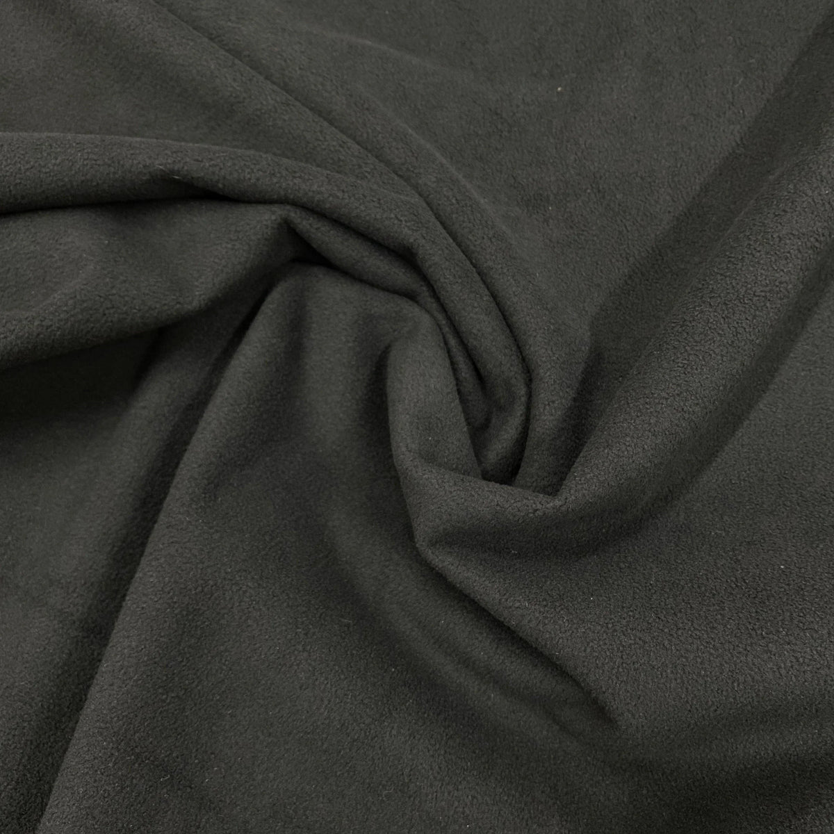 Close-up of draped charcoal grey premium natural fabric from Nature's Fabrics