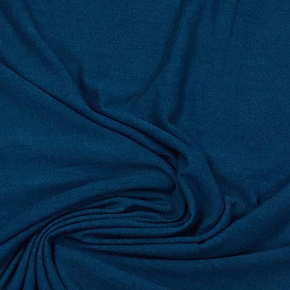 Close-up of draped deep blue premium natural fabric from Nature's Fabrics.