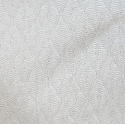 Close-up of white textured natural fabric from Nature's Fabrics