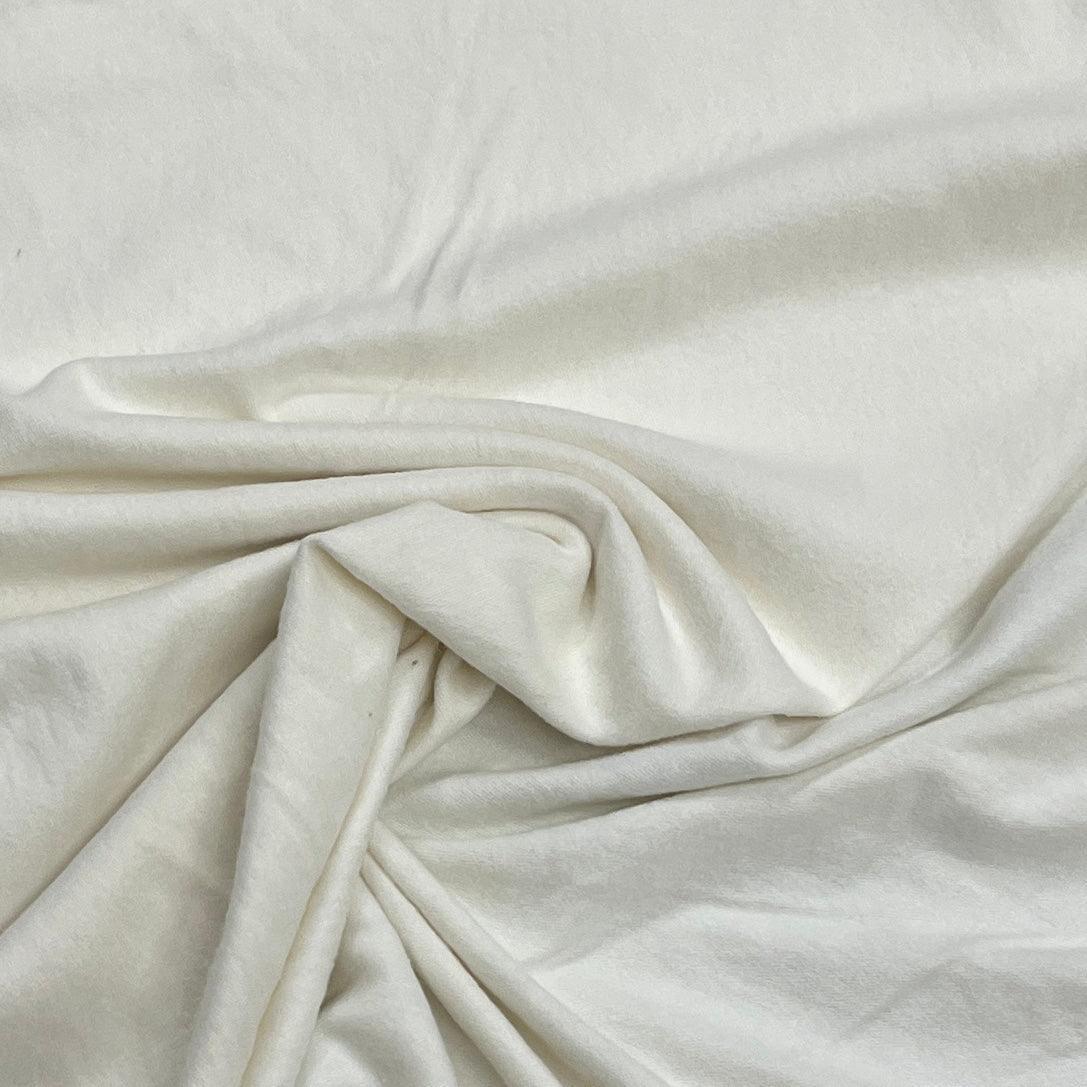 Close-up of draped white organic cotton fabric from Nature's Fabrics