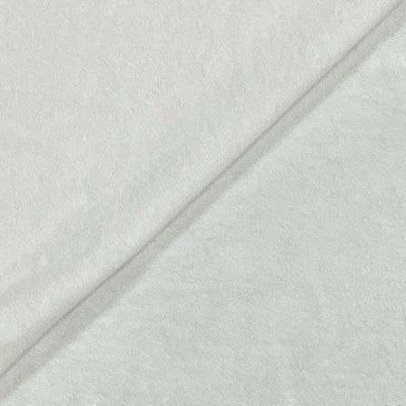 Close-up of white textured natural fabric from Nature's Fabrics.