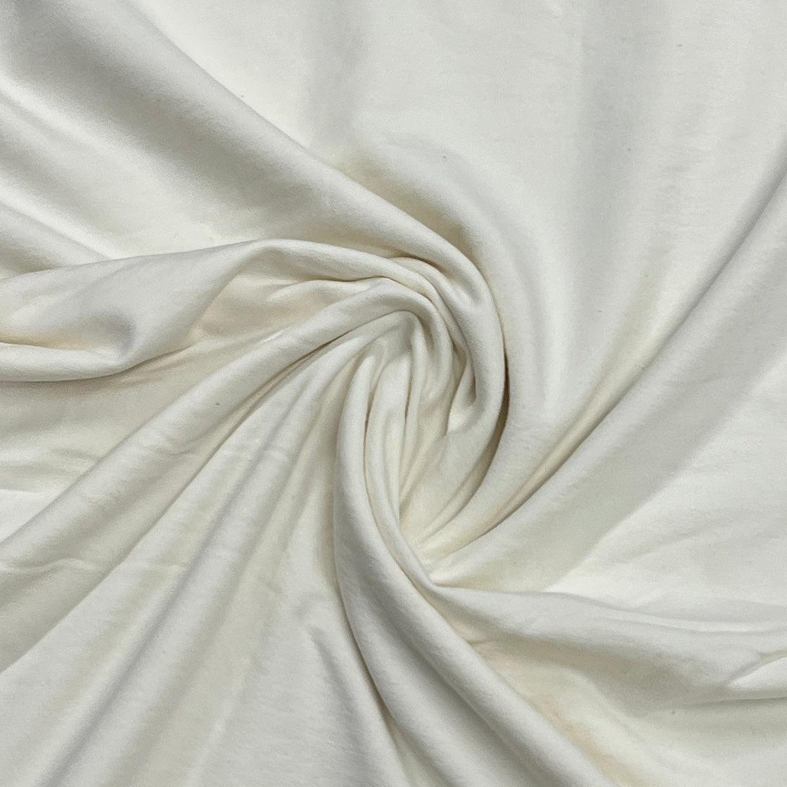 Close-up of draped white organic cotton fabric from Nature's Fabrics.