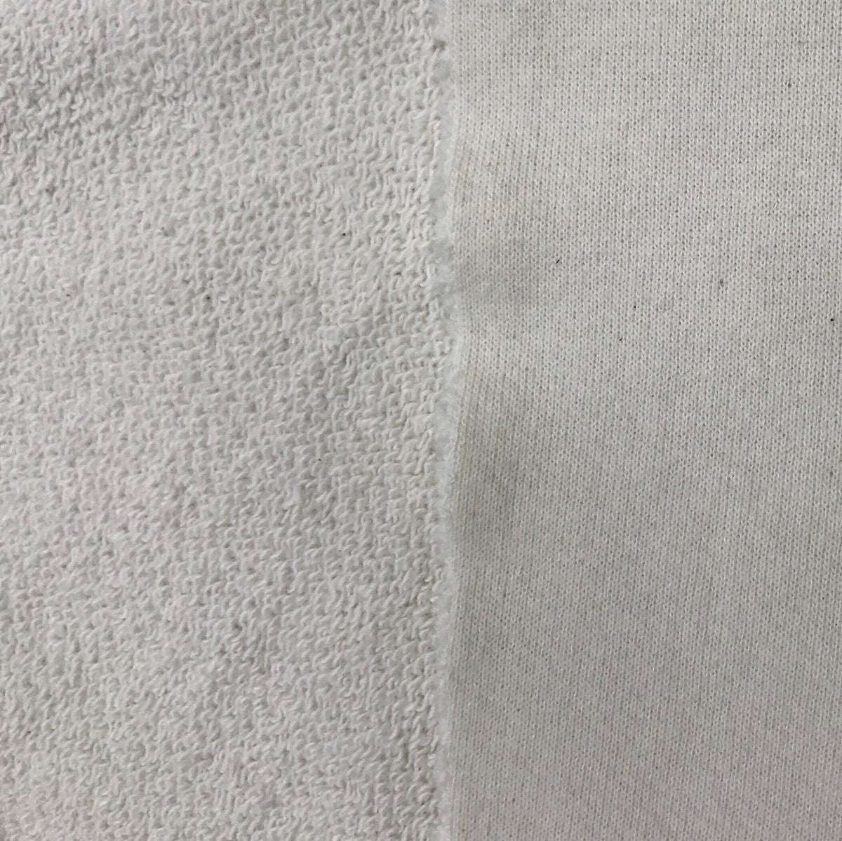 Nature's Fabrics white terry cloth fabric showing looped and smooth sides.
