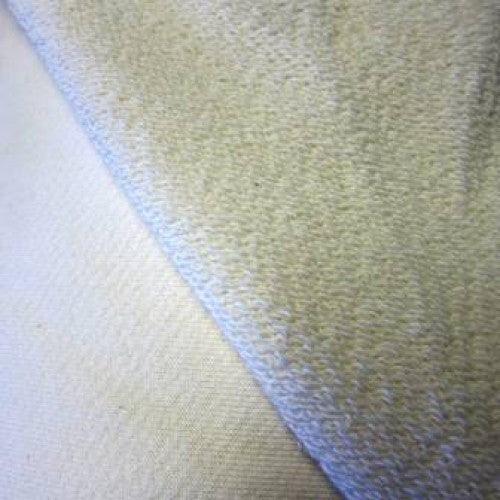 Close-up of soft, cream-colored natural fabric from Nature's Fabrics.