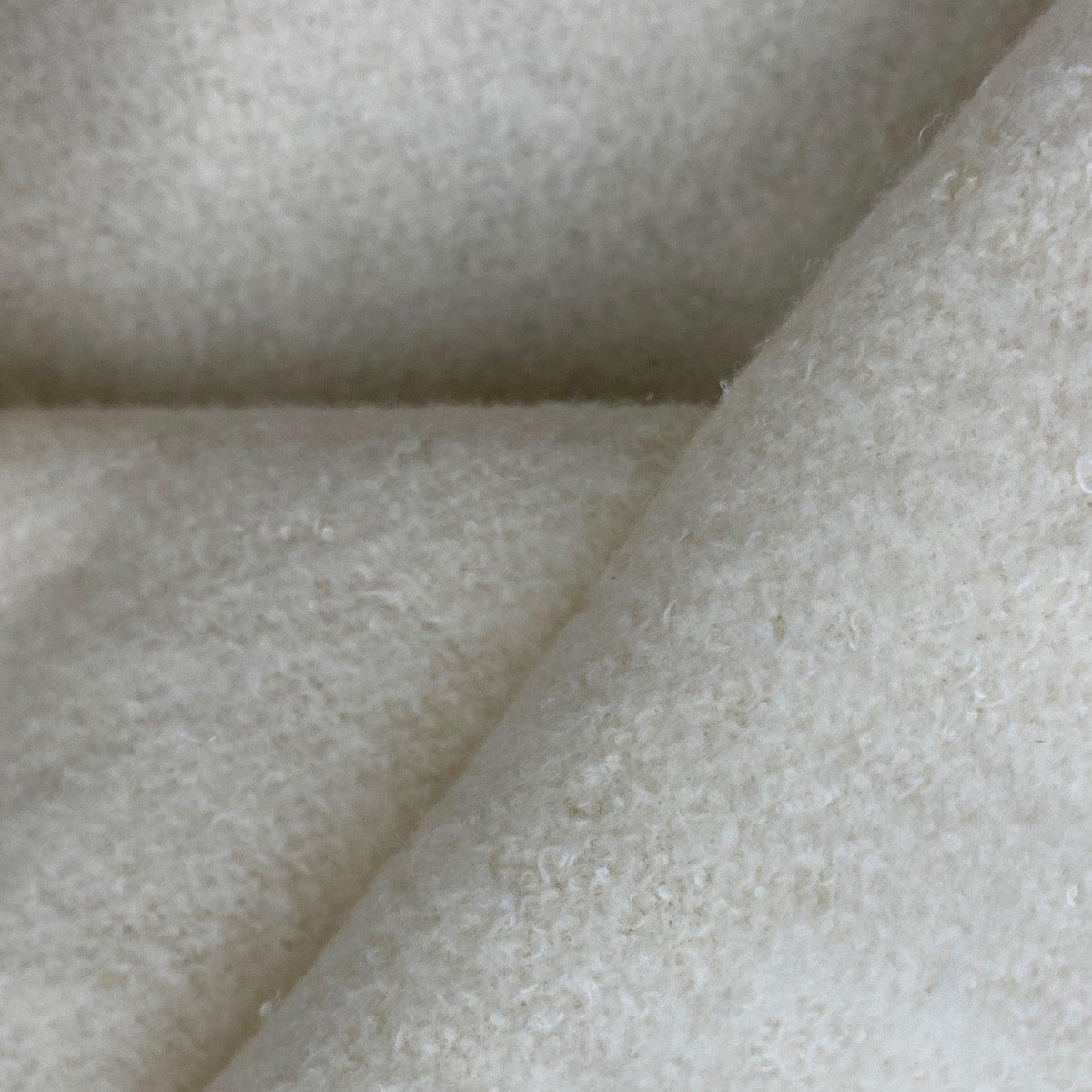 Close-up of white textured natural wool fabric from Nature's Fabrics