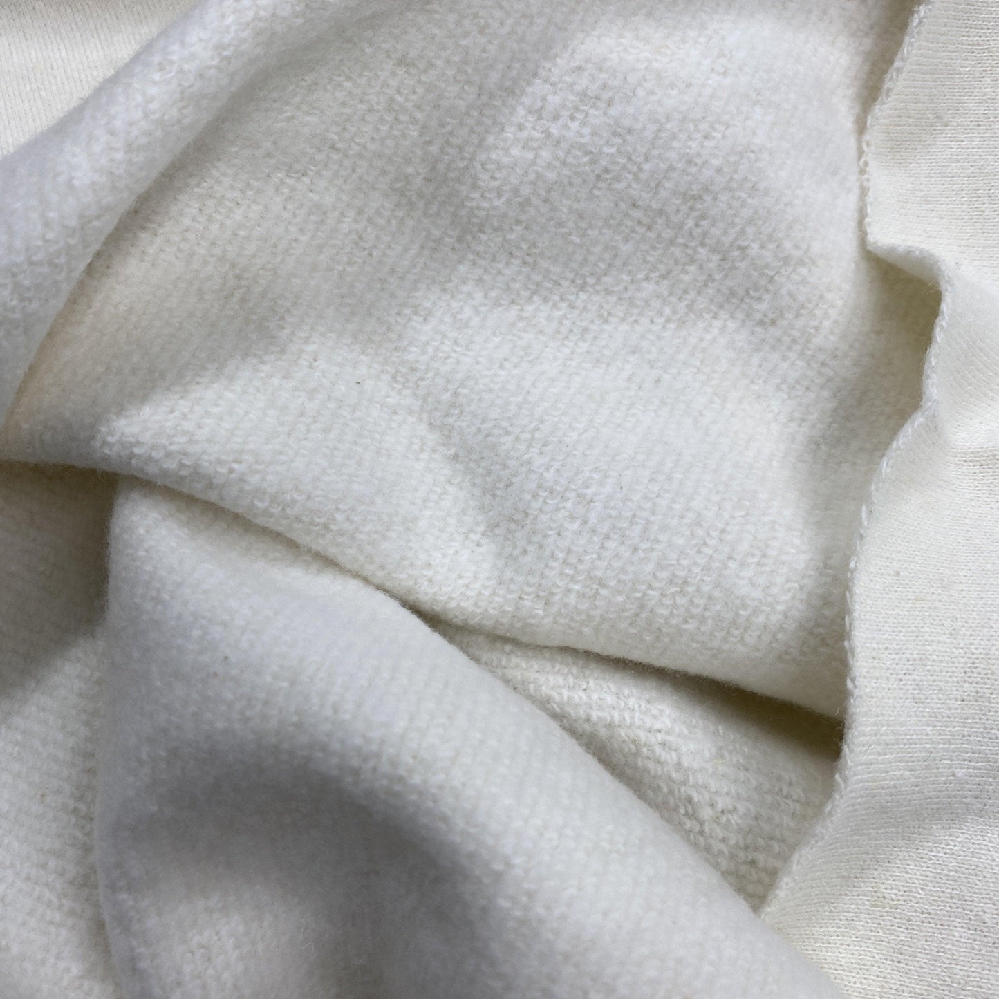 Close-up of draped white organic cotton fabric from Nature's Fabrics.