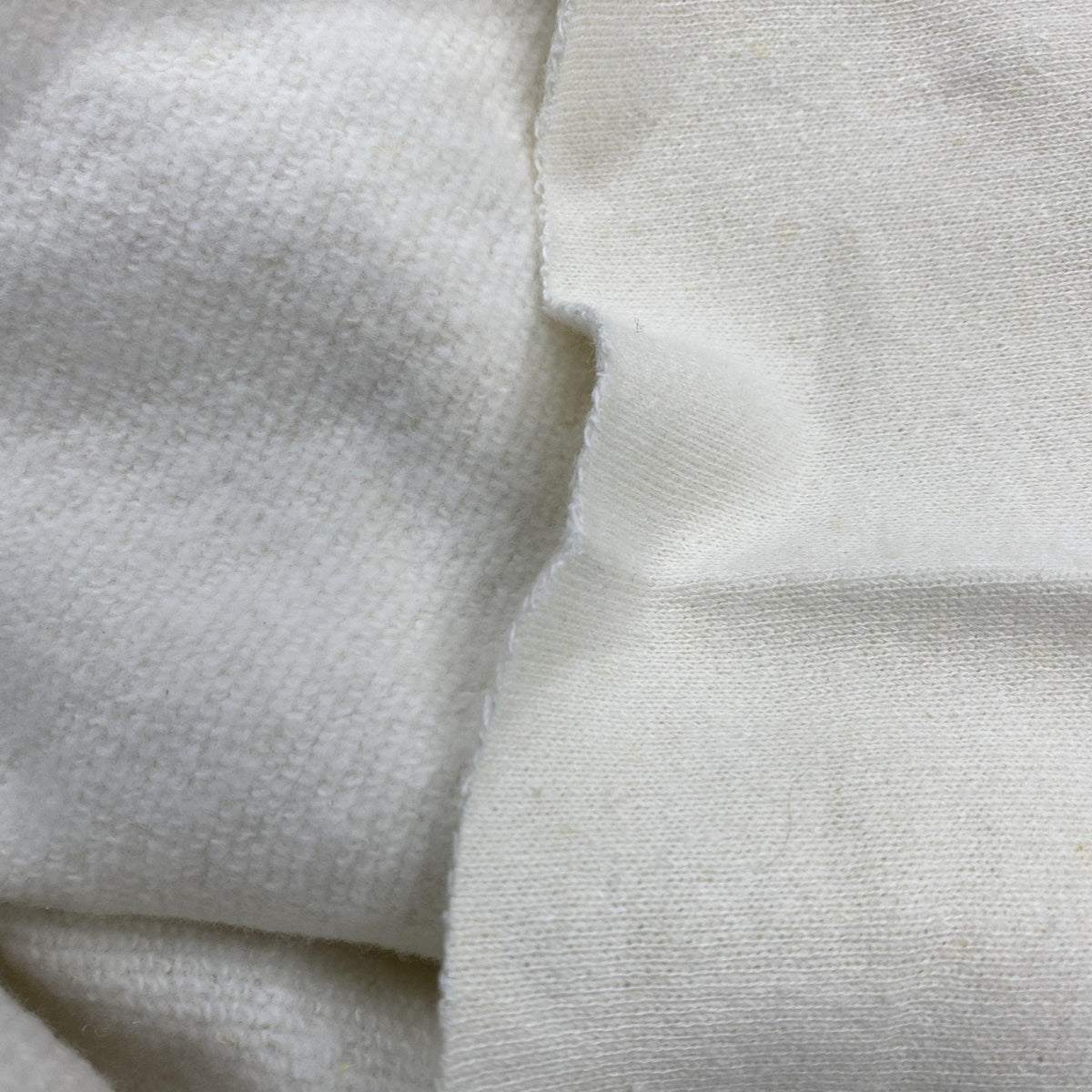 Close-up of draped white organic cotton fabric from Nature's Fabrics