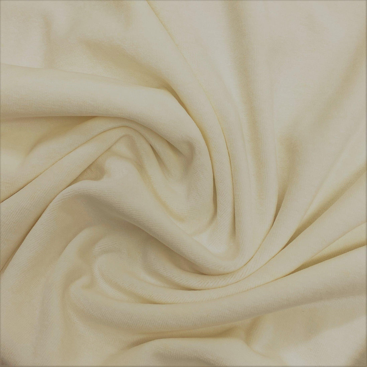 Close-up of draped cream-colored organic fabric from Nature's Fabrics