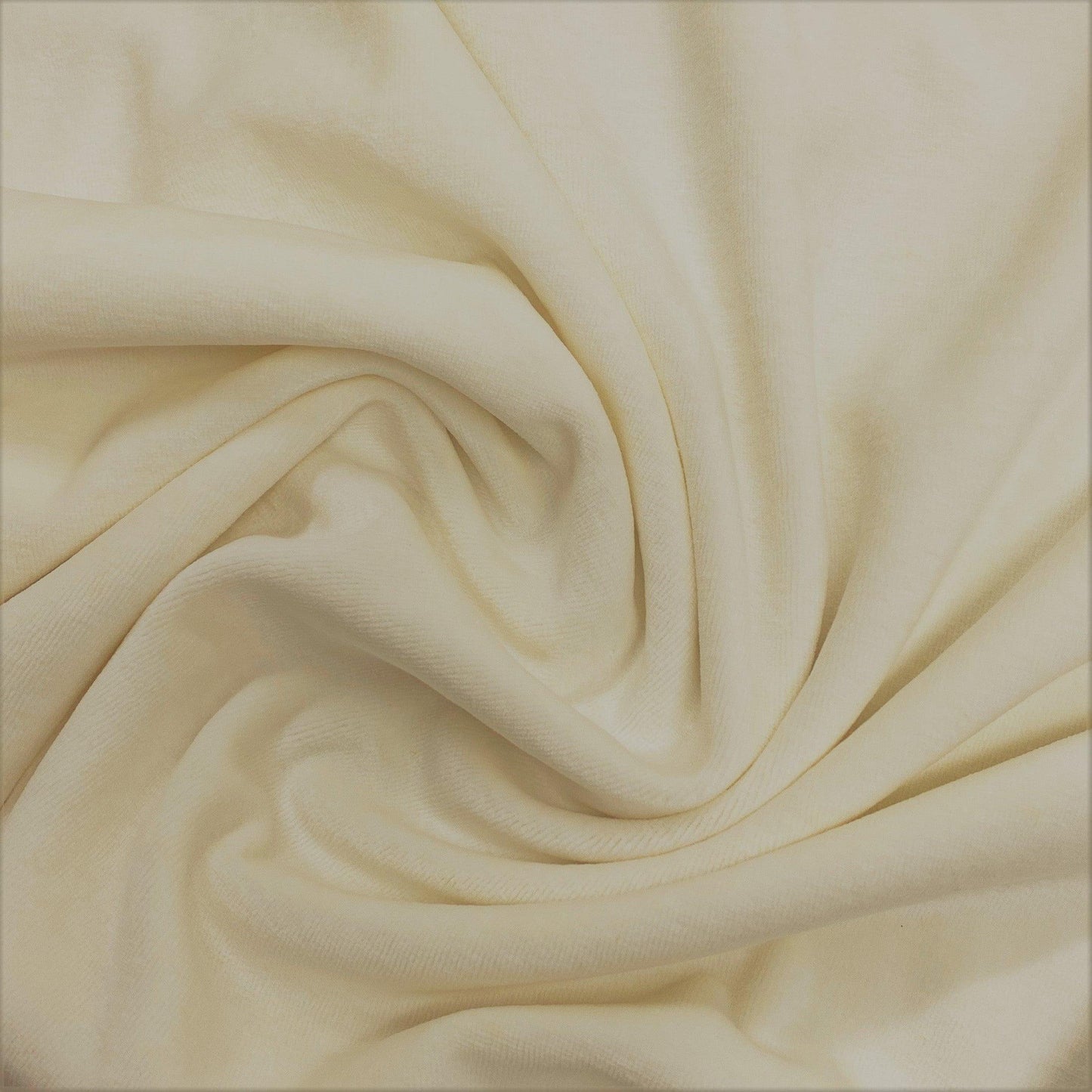 Close-up of draped cream-colored organic fabric from Nature's Fabrics