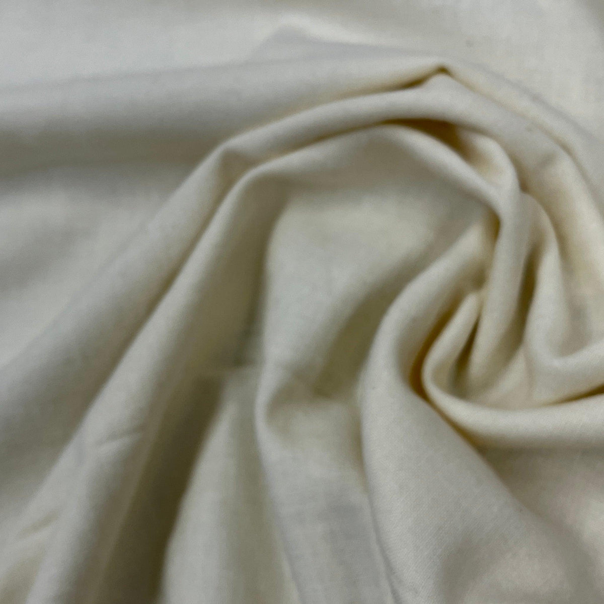 Close-up of draped white natural fabric from Nature's Fabrics