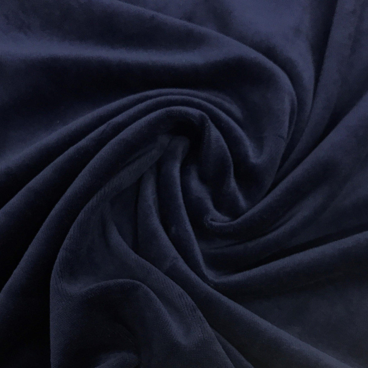 Close-up of draped navy blue premium fabric from Nature's Fabrics.