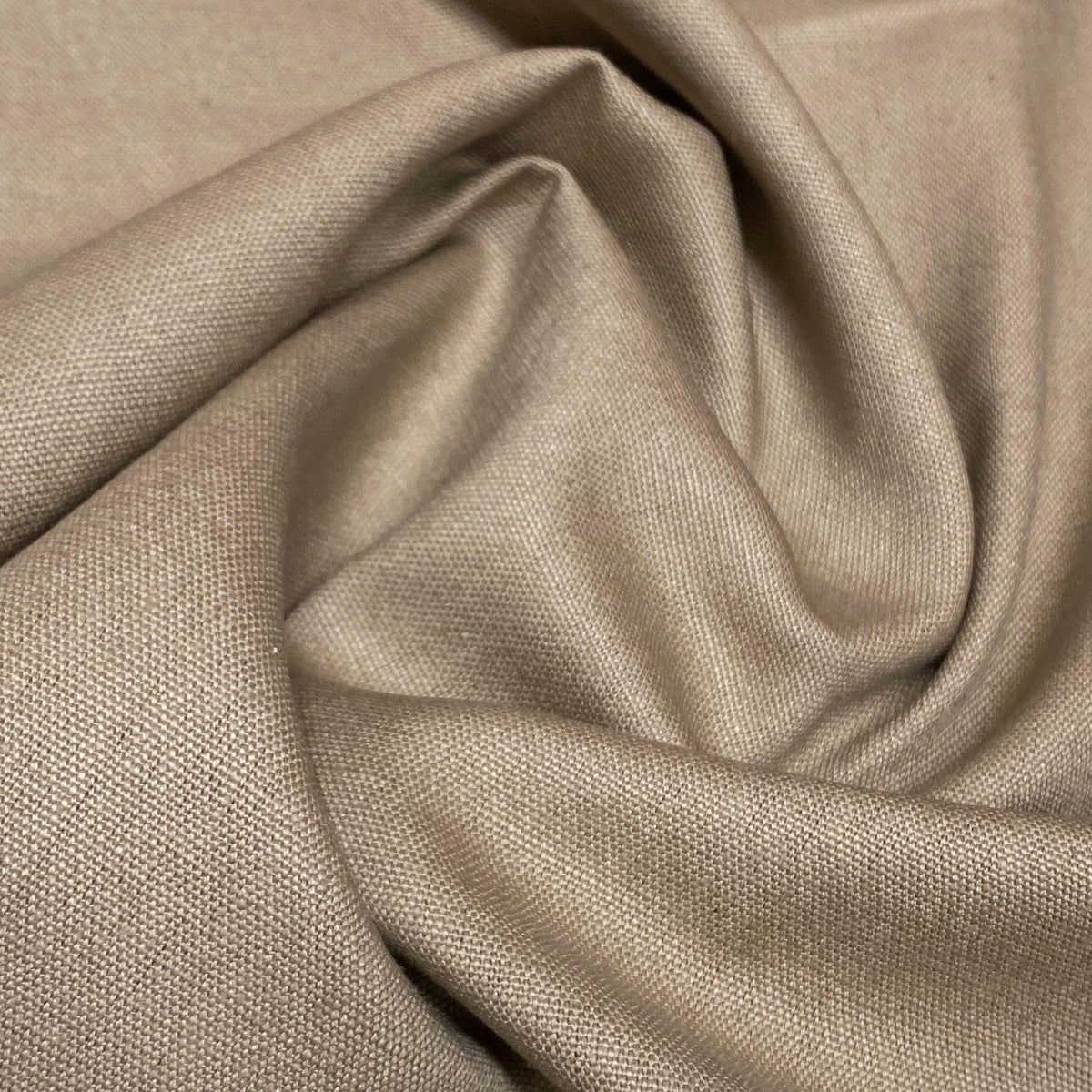 Close-up of draped beige natural fabric by Nature's Fabrics