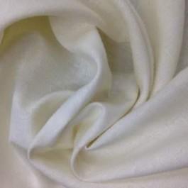Close-up of draped cream-colored natural fabric from Nature's Fabrics.