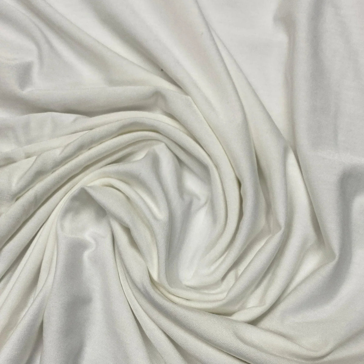 Swirled white organic cotton fabric from Nature's Fabrics