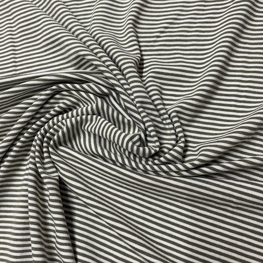 Nature's Fabrics olive green and white striped ribbed cotton fabric draped in folds