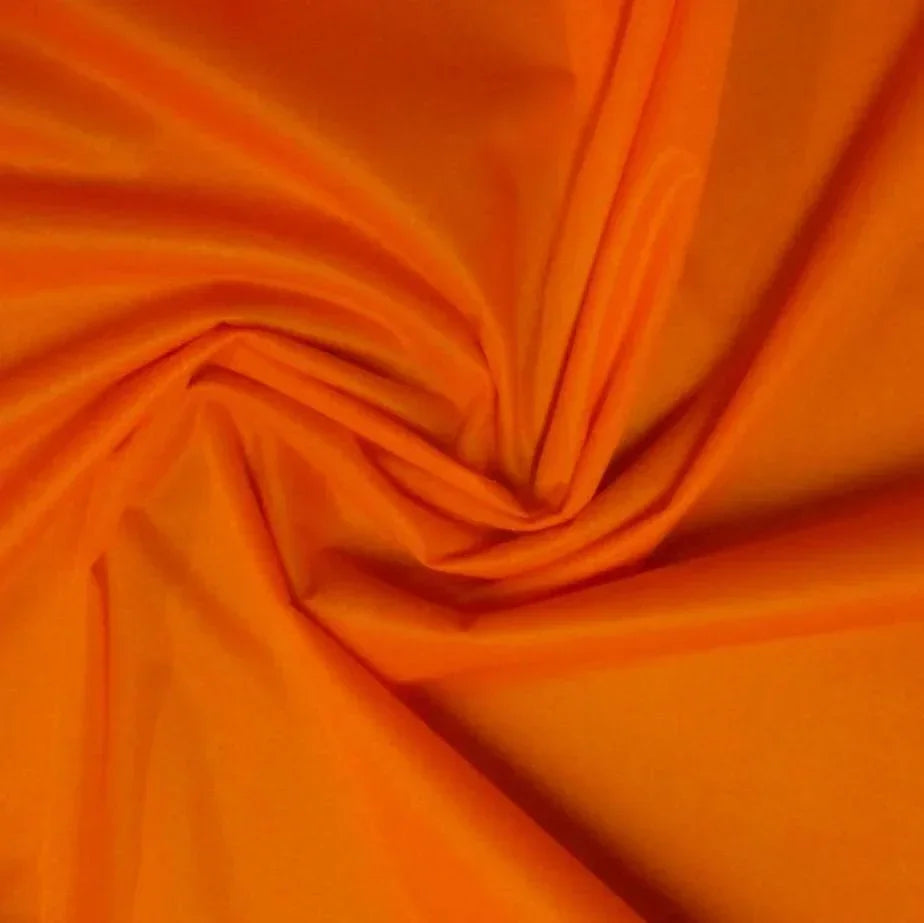 Bright orange draped fabric from Nature's Fabrics