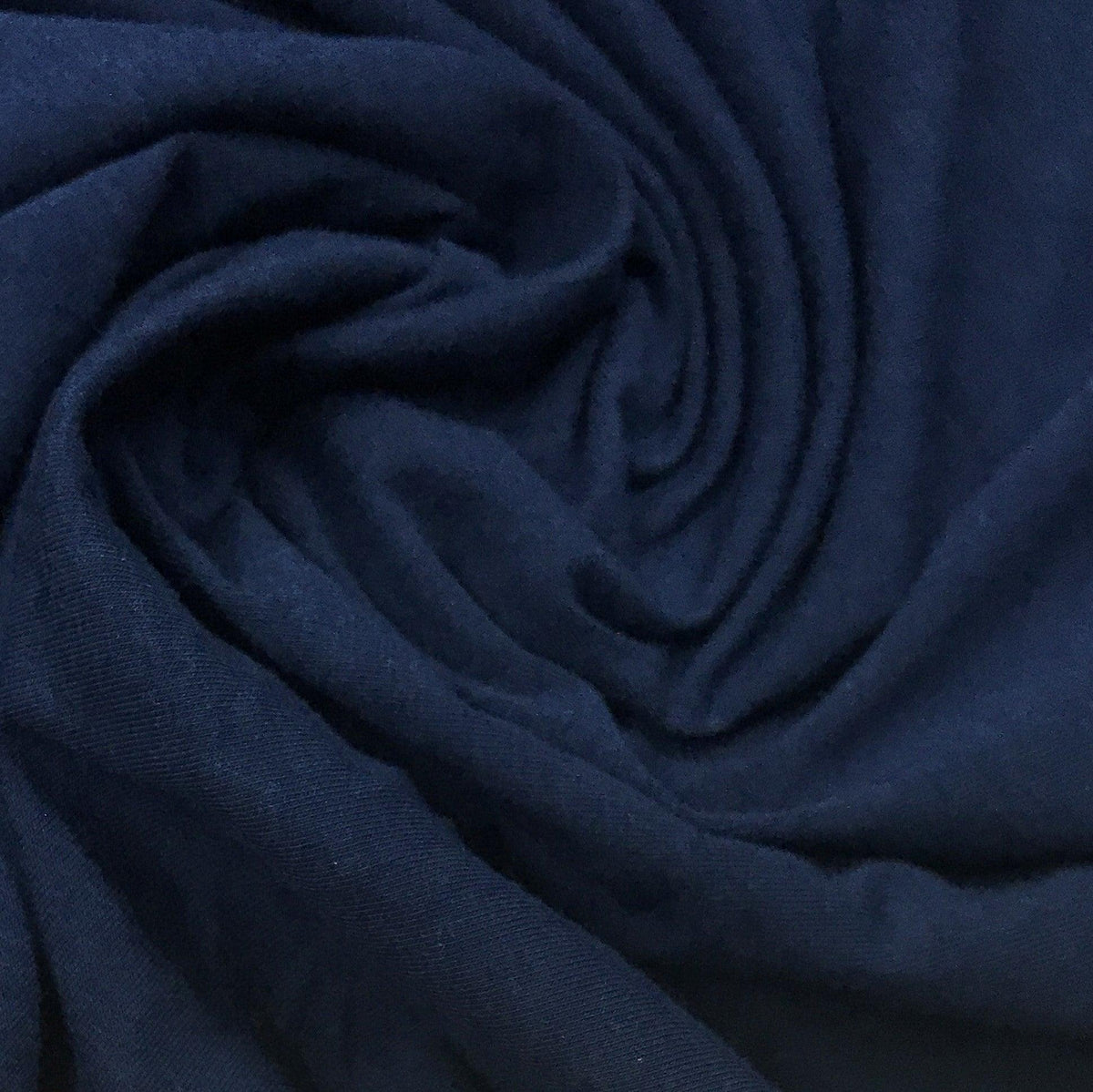 Navy blue premium natural fabric by Nature's Fabrics, draped in soft folds.