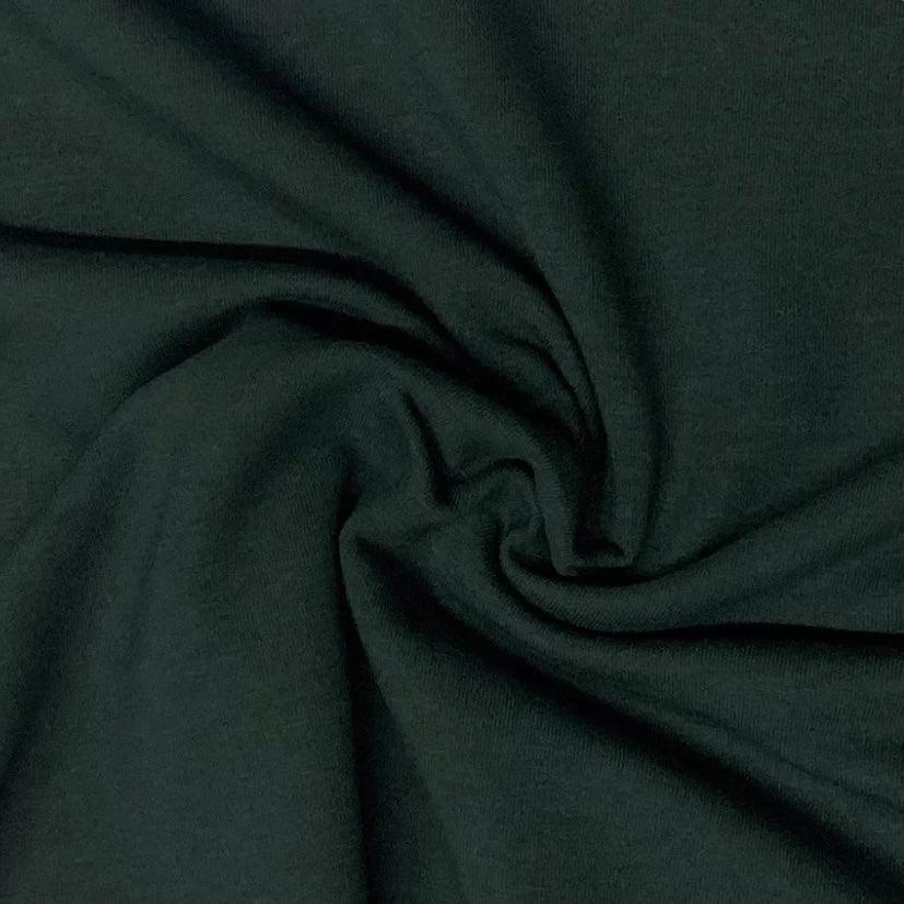 Dark green premium natural fabric draped from Nature's Fabrics