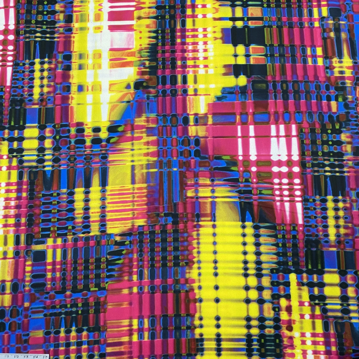 Abstract colorful geometric pattern fabric by Nature's Fabrics in pink, yellow, and blue.
