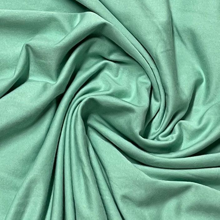 Nature's Fabrics mint green organic fabric with soft folds and drapes
