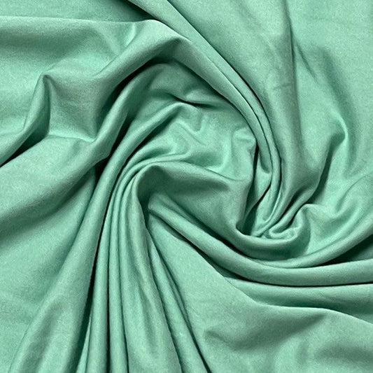 Nature's Fabrics mint green organic fabric with soft folds and drapes