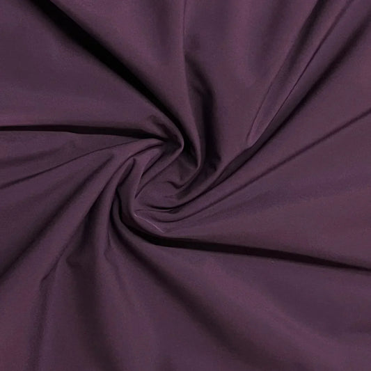 Close-up of draped purple natural fabric by Nature's Fabrics