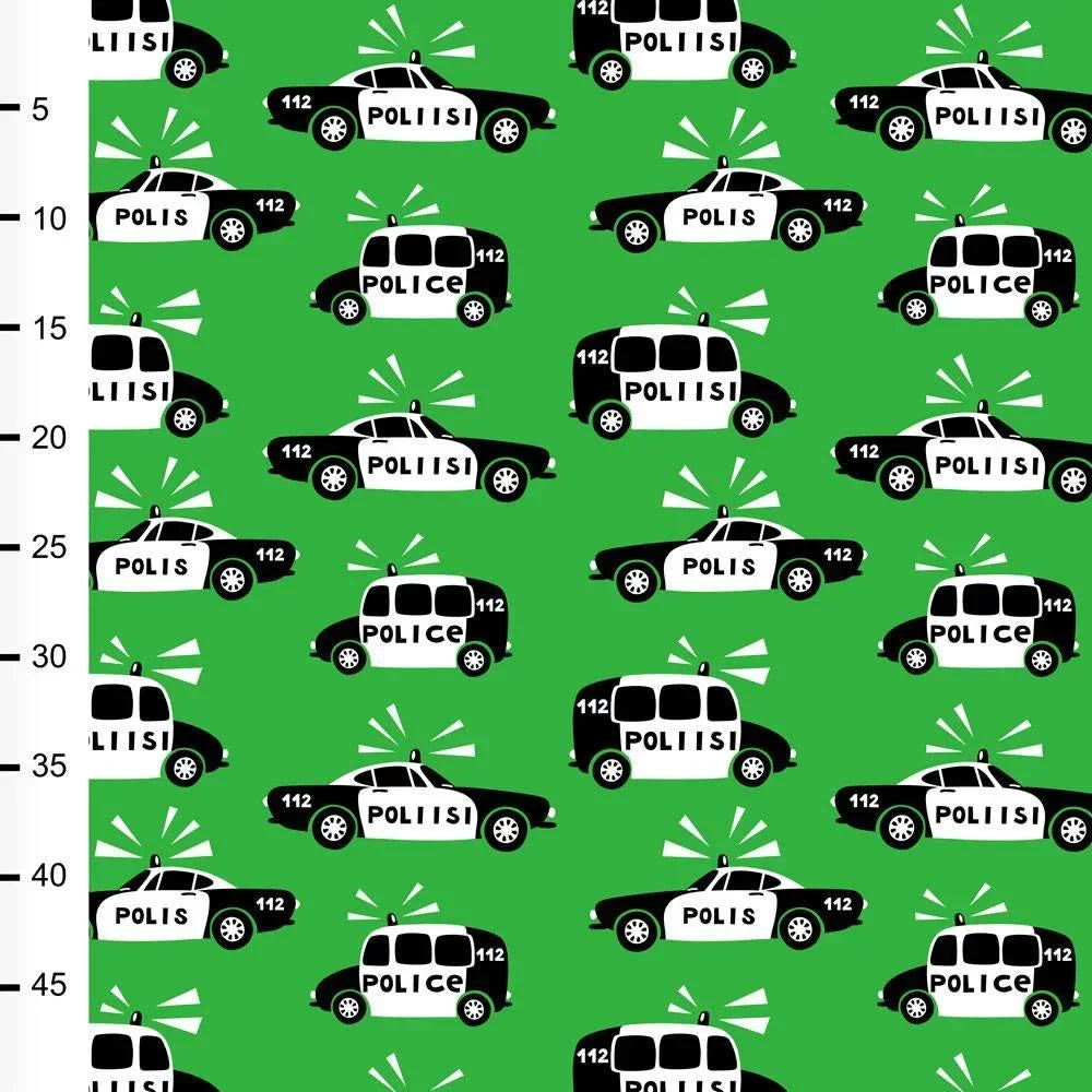 Nature's Fabrics green fabric with a repeated pattern of black and white police cars.