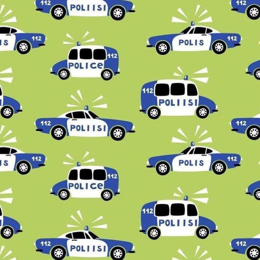 Nature's Fabrics green fabric print with illustrated blue and white police cars.