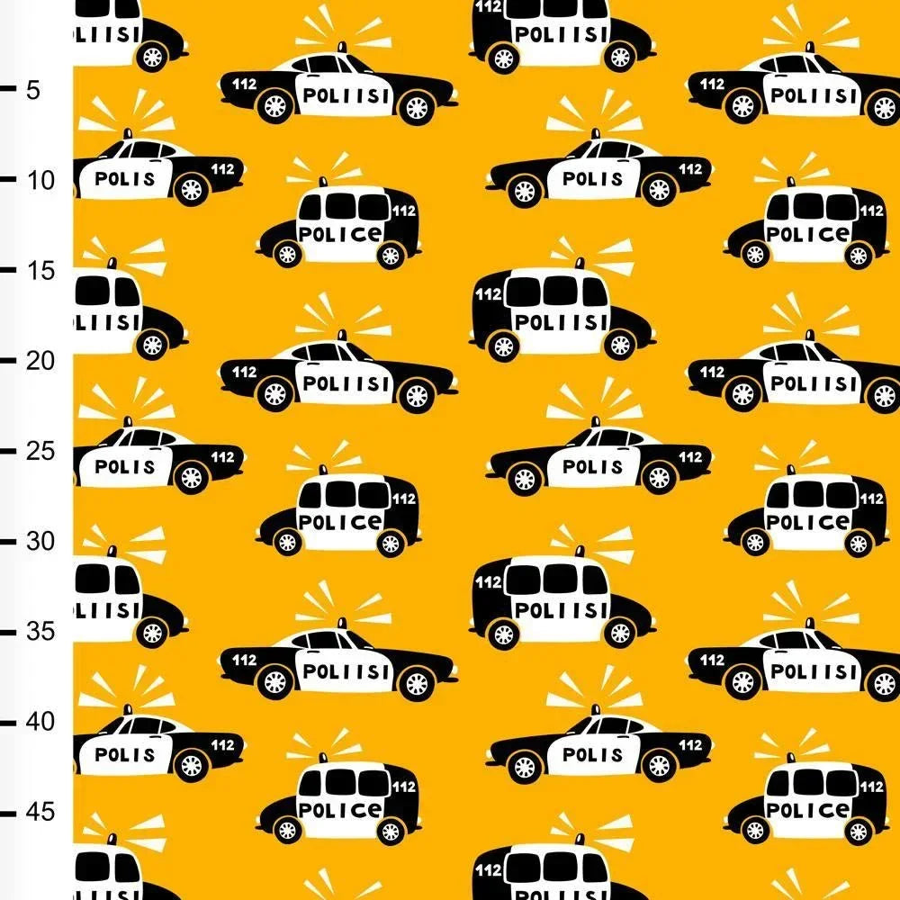 Nature's Fabrics yellow fabric with a pattern of black and white police cars.