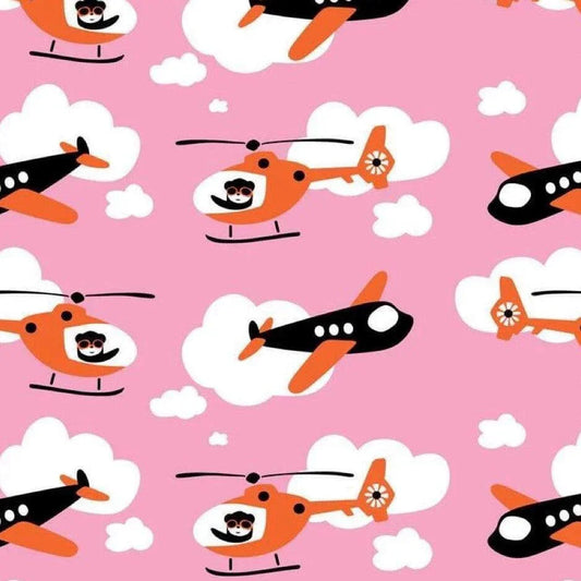 Nature's Fabrics pink fabric with orange and black planes and helicopters pattern