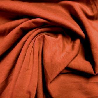 Draped rust-colored natural fabric from Nature's Fabrics.