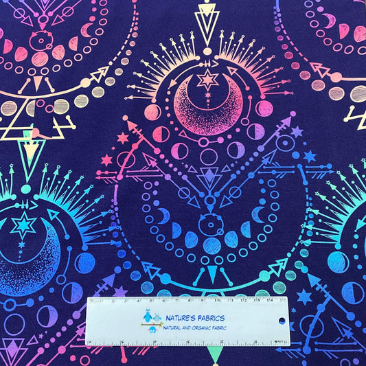 Nature's Fabrics celestial printed fabric with moon and star patterns in gradient colors.