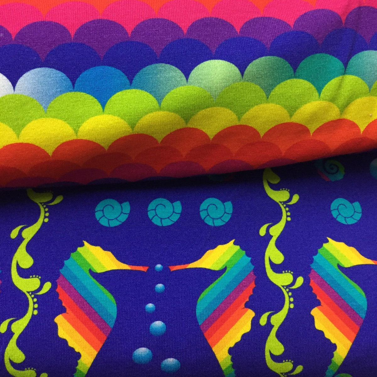 Nature's Fabrics rainbow seahorse and scallop print organic cotton fabric.