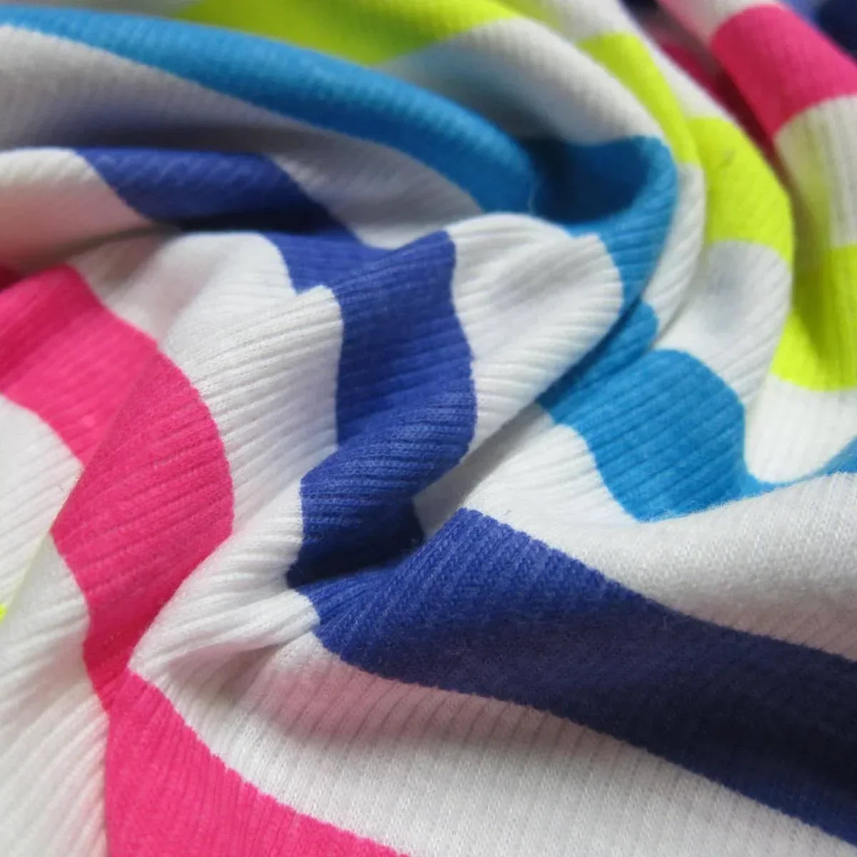 Colorful striped natural fabric by Nature's Fabrics in blue, pink, and lime green.