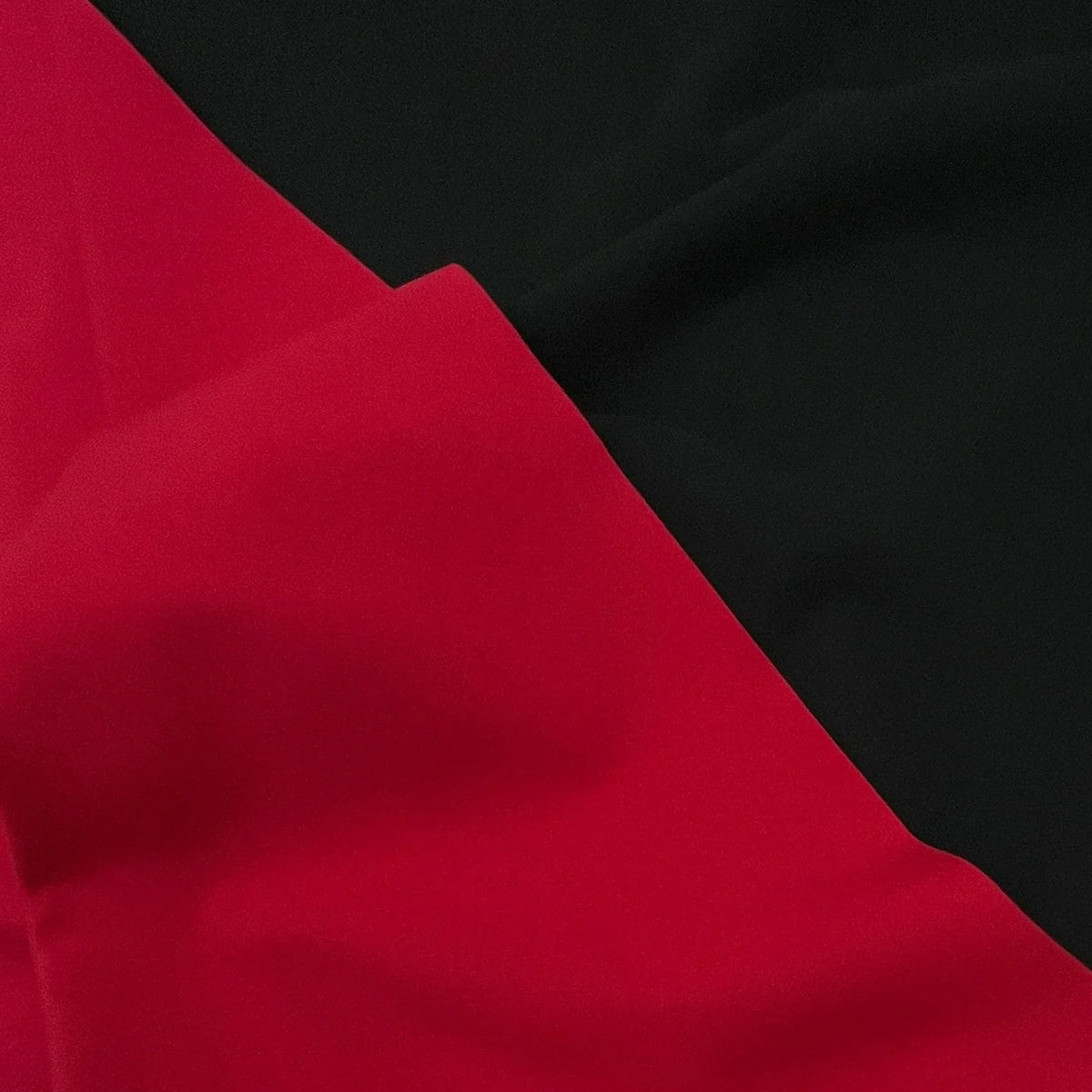 Close-up of Nature's Fabrics red and black premium fabric textures.