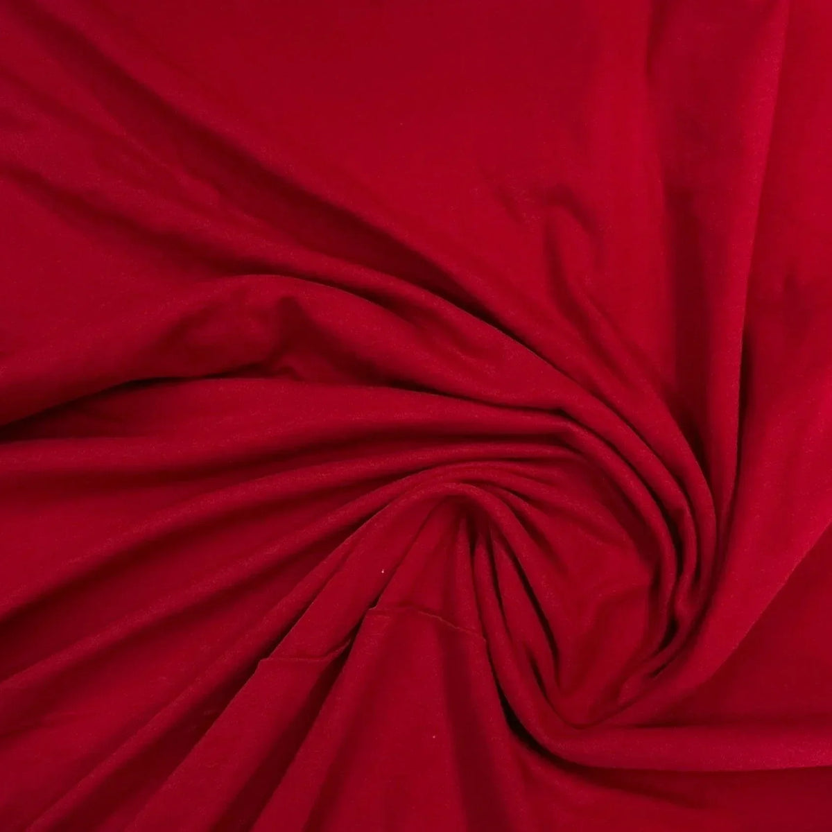 Red organic fabric swirled in a spiral by Nature's Fabrics