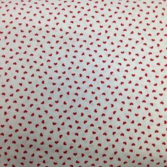 Nature's Fabrics white organic cotton fabric with red heart print pattern