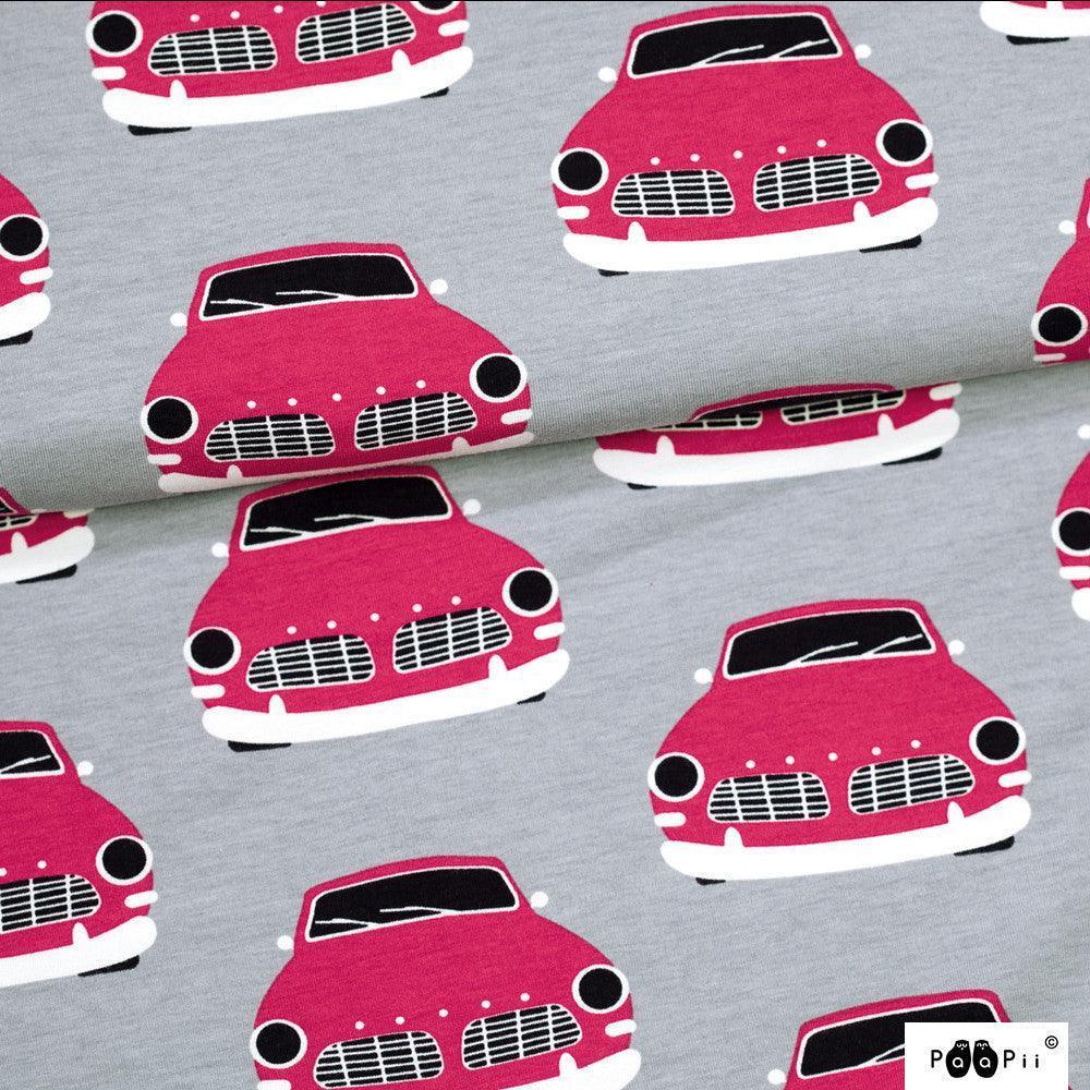 Nature's Fabrics grey fabric with a pink vintage car print.