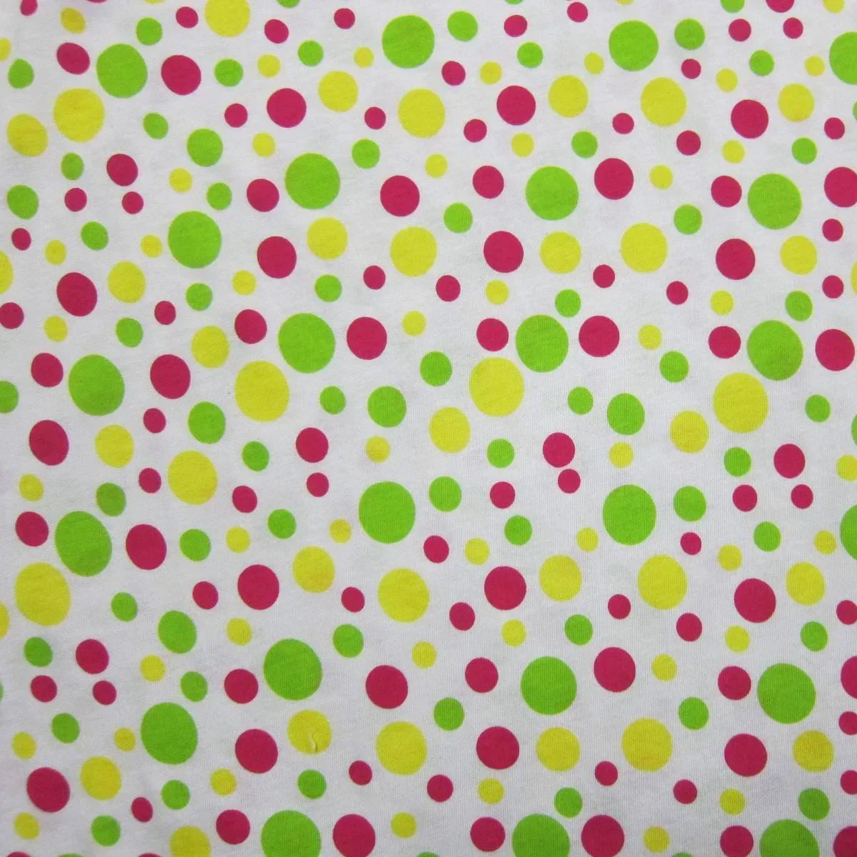 Nature's Fabrics multi-colored polka dot pattern on white organic cotton fabric.