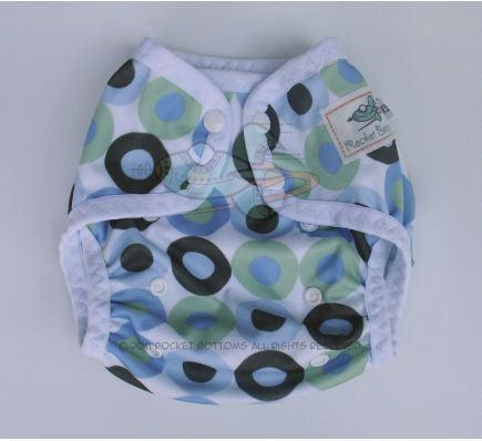 Rocket Bottoms reusable cloth diaper with blue and green circle pattern