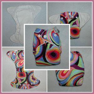 Nature's Fabrics reusable cloth diapers in white and colorful psychedelic patterns.
