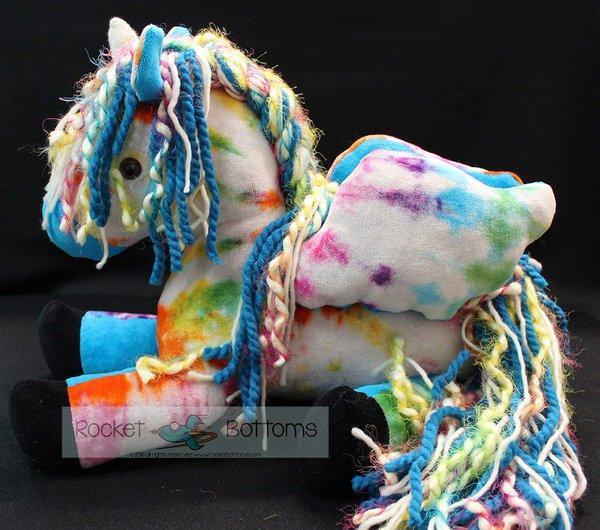 Colorful handmade plush unicorn with yarn mane and tail by Rocket Bottoms
