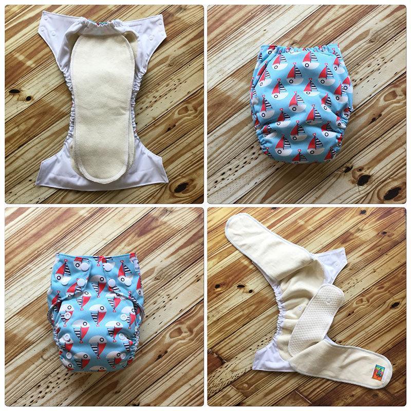 Four views of Nature's Fabrics reusable cloth diapers on a wooden background.