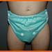 Baby wearing Nature's Fabrics light blue cloth diaper