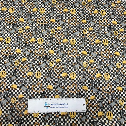 Nature's Fabrics organic cotton fabric with a black and white checkerboard skeleton pattern