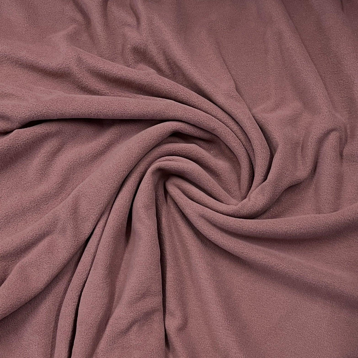 Nature's Fabrics mauve colored soft fleece fabric draped in folds